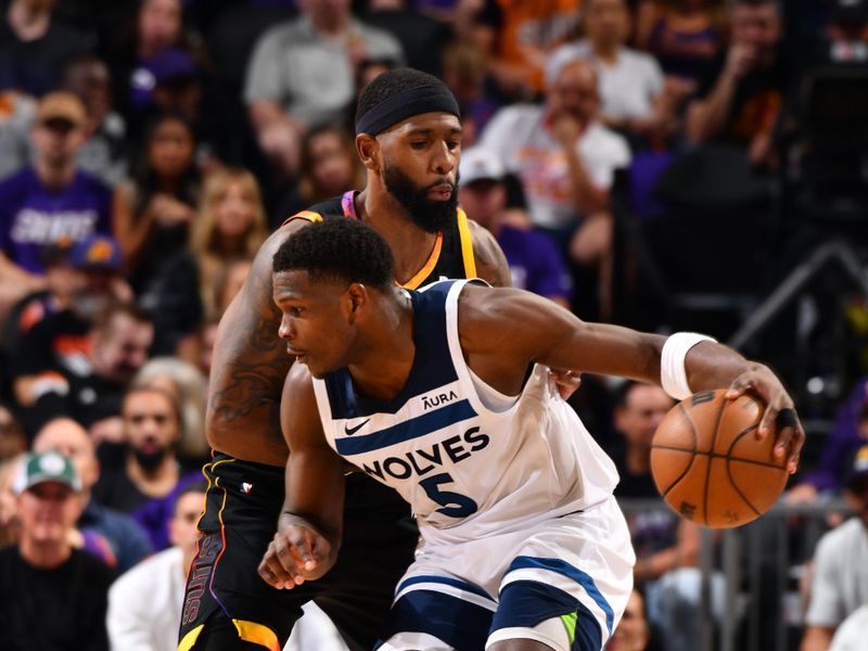 PHOENIX, AZ - APRIL 4: Anthony Edwards #5 of the Minnesota Timberwolves handles the ball during the game against the Phoenix Suns during Round 1 Game 4 of the 2024 NBA Playoffs on April 4, 2023 at Footprint Center in Phoenix, Arizona. NOTE TO USER: User expressly acknowledges and agrees that, by downloading and or using this photograph, user is consenting to the terms and conditions of the Getty Images License Agreement. Mandatory Copyright Notice: Copyright 2024 NBAE (Photo by Barry Gossage/NBAE via Getty Images)