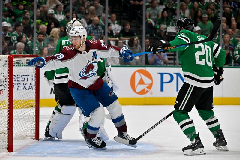 May 15, 2024; Dallas, Texas, USA; Dallas Stars defenseman Ryan Suter (20) is called for a penalty after grabbing the sick of Colorado Avalanche center Nathan MacKinnon (29) during the first period in game five of the second round of the 2024 Stanley Cup Playoffs at American Airlines Center. Mandatory Credit: Jerome Miron-USA TODAY Sports