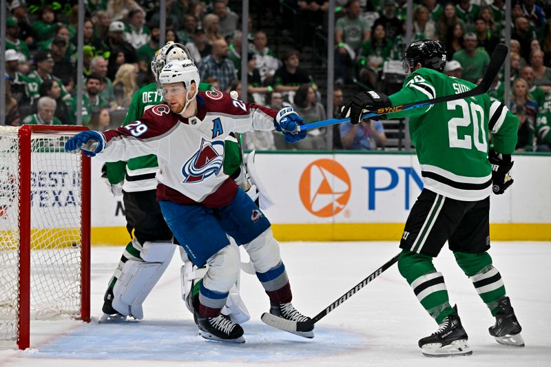 May 15, 2024; Dallas, Texas, USA; Dallas Stars defenseman Ryan Suter (20) is called for a penalty after grabbing the sick of Colorado Avalanche center Nathan MacKinnon (29) during the first period in game five of the second round of the 2024 Stanley Cup Playoffs at American Airlines Center. Mandatory Credit: Jerome Miron-USA TODAY Sports