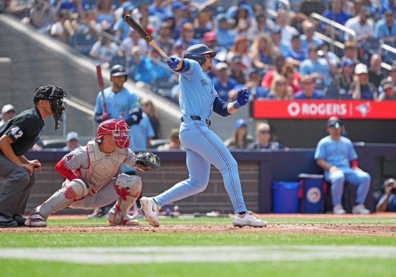 Aug 25, 2024; Toronto, Ontario, CAN; Toronto Blue Jays right fielder Addison Barger (47) hits a single against the Los Angeles Angels during the third inning at Rogers Centre. Mandatory Credit: Nick Turchiaro-USA TODAY Sports