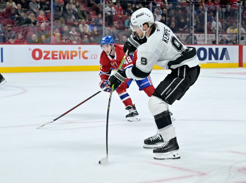 Oct 17, 2024; Montreal, Quebec, CAN; Los Angeles Kings forward Adrian Kempe (9) scores an empty  goal against the Montreal Canadiens during the third period at the Bell Centre. Mandatory Credit: Eric Bolte-Imagn Images