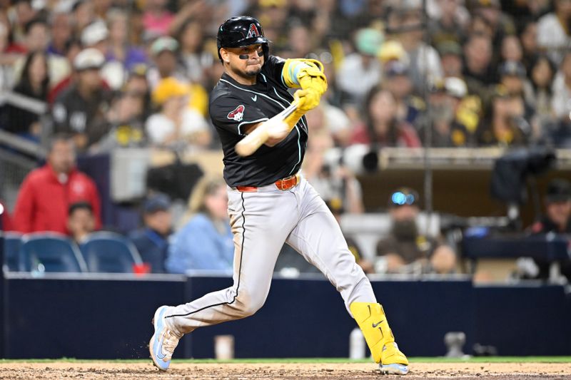 Sep 27, 2025; San Diego, California, USA; Arizona Diamondbacks catcher Gabriel Moreno (14) hits a single during the eighth inning against the San Diego Padres at Petco Park. Mandatory Credit: Denis Poroy-Imagn Images