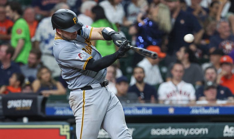 Jul 30, 2024; Houston, Texas, USA; Pittsburgh Pirates catcher Joey Bart (14) hits a single during the fourth inning against the Houston Astros at Minute Maid Park. Mandatory Credit: Troy Taormina-USA TODAY Sports