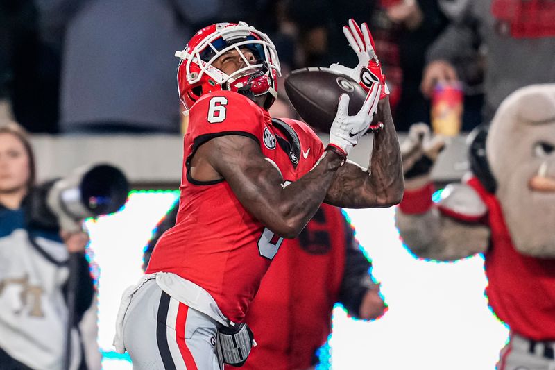 Nov 25, 2023; Atlanta, Georgia, USA; Georgia Bulldogs wide receiver Dominic Lovett (6) catches a touchdown pass against the Georgia Tech Yellow Jackets during the first quarter at Hyundai Field. Mandatory Credit: Dale Zanine-USA TODAY Sports