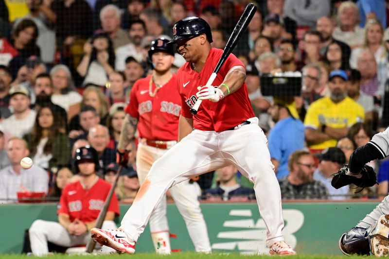 Sep 14, 2023; Boston, Massachusetts, USA; Boston Red Sox designated hitter Rafael Devers (11) is hit in the foot by a pitch from New York Yankees starting pitcher Clarke Schmidt (not pictured) during the fifth inning at Fenway Park. Mandatory Credit: Eric Canha-USA TODAY Sports