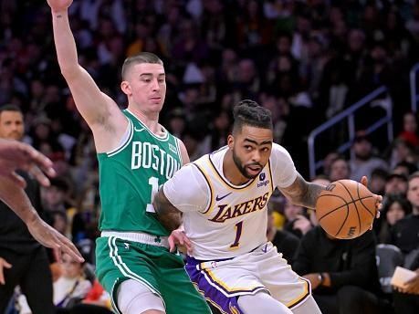 LOS ANGELES, CALIFORNIA - DECEMBER 25: D'Angelo Russell #1 of the Los Angeles Lakers drives past Payton Pritchard #11 of the Boston Celtics at Crypto.com Arena on December 25, 2023 in Los Angeles, California. NOTE TO USER: User expressly acknowledges and agrees that, by downloading and or using this photograph, User is consenting to the terms and conditions of the Getty Images License Agreement.(Photo by Jayne Kamin-Oncea/Getty Images)