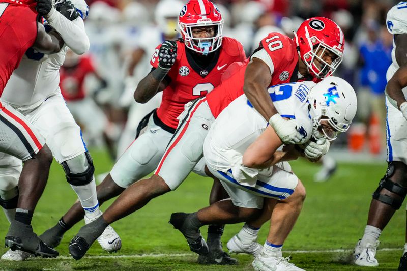 Oct 7, 2023; Athens, Georgia, USA; Georgia Bulldogs linebacker Jamon Dumas-Johnson (10) sacks Kentucky Wildcats quarterback Devin Leary (13) during the second half at Sanford Stadium. Mandatory Credit: Dale Zanine-USA TODAY Sports