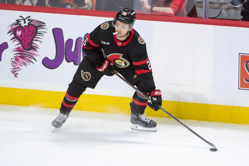 Feb 15, 2024; Ottawa, Ontario, CAN; Ottawa Senators defenseman Erik Brannstrom (26) controls the puck in the third period against the Anaheim Ducks at the Canadian Tire Centre. Mandatory Credit: Marc DesRosiers-USA TODAY Sports