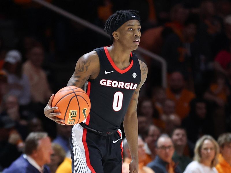 Jan 25, 2023; Knoxville, Tennessee, USA; Georgia Bulldogs guard Terry Roberts (0) dribbles during the first half against the Tennessee Volunteers at Thompson-Boling Arena. Mandatory Credit: Randy Sartin-USA TODAY Sports