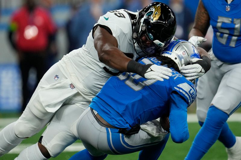 Jacksonville Jaguars defensive end Jeremiah Ledbetter (99) sacks Detroit Lions quarterback Teddy Bridgewater (50) during the first half of a preseason NFL football game, Saturday, Aug. 19, 2023, in Detroit. (AP Photo/Paul Sancya)