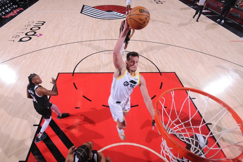 PORTLAND, OR - DECEMBER 6: Drew Eubanks #15 of the Utah Jazz dunks the ball during the game against the Portland Trail Blazers on December 6, 2024 at the Moda Center Arena in Portland, Oregon. NOTE TO USER: User expressly acknowledges and agrees that, by downloading and or using this photograph, user is consenting to the terms and conditions of the Getty Images License Agreement. Mandatory Copyright Notice: Copyright 2024 NBAE (Photo by Cameron Browne/NBAE via Getty Images)