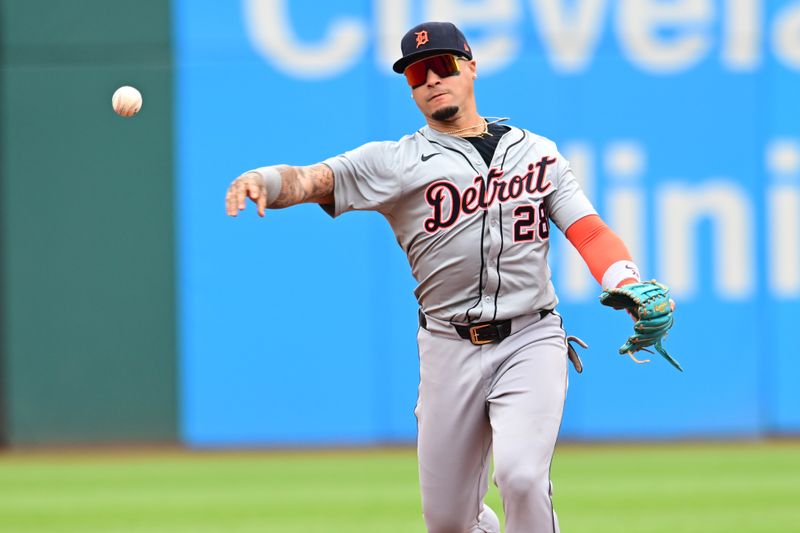 Jul 25, 2024; Cleveland, Ohio, USA; Detroit Tigers shortstop Javier Baez (28) throws out Cleveland Guardians center fielder Angel Martinez (not pictured) during the first inning at Progressive Field. Mandatory Credit: Ken Blaze-USA TODAY Sports