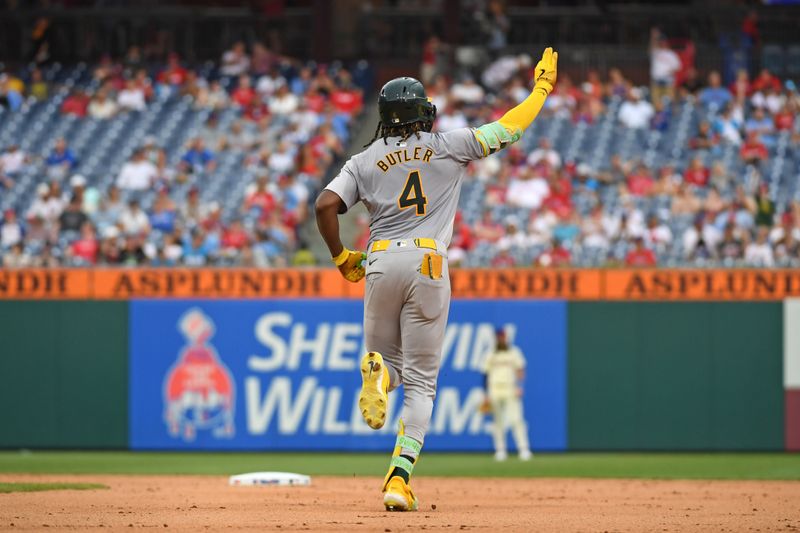 Jul 14, 2024; Philadelphia, Pennsylvania, USA; Oakland Athletics outfielder Lawrence Butler (4) celebrates his third home run of the game against the Philadelphia Phillies during the seventh inning at Citizens Bank Park. Mandatory Credit: Eric Hartline-USA TODAY Sports