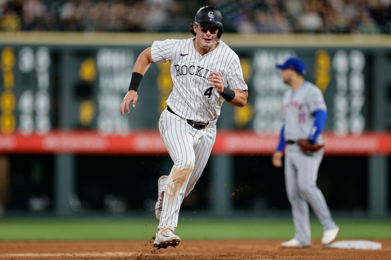 Aug 6, 2024; Denver, Colorado, USA; Colorado Rockies first baseman Michael Toglia (4) runs to third in the eighth inning against the New York Mets at Coors Field. Mandatory Credit: Isaiah J. Downing-USA TODAY Sports