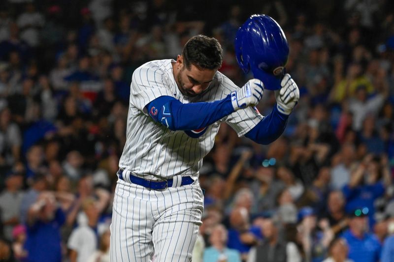 Jul 17, 2023; Chicago, Illinois, USA;  Chicago Cubs center fielder Mike Tauchman (40) throws his hat after lining out against the Washington Nationals during the eighth inning at Wrigley Field. Mandatory Credit: Matt Marton-USA TODAY Sports