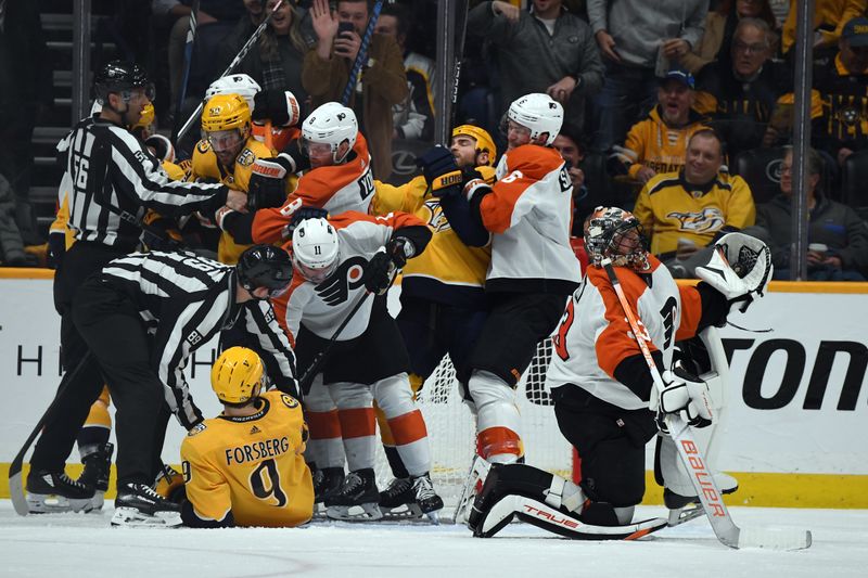 Dec 12, 2023; Nashville, Tennessee, USA; Nashville Predators and Philadelphia Flyers players have to be separated after a save by Philadelphia Flyers goaltender Samuel Ersson (33) during the second period at Bridgestone Arena. Mandatory Credit: Christopher Hanewinckel-USA TODAY Sports