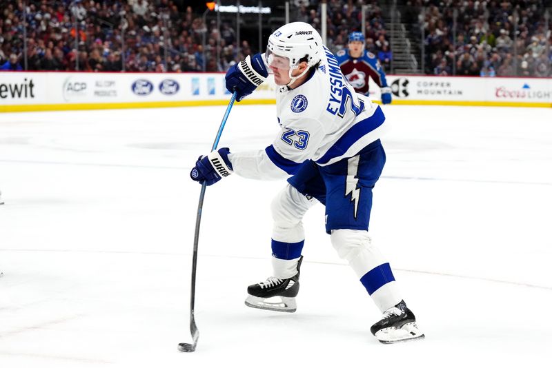 Nov 27, 2023; Denver, Colorado, USA; Tampa Bay Lightning center Michael Eyssimont (23) shoots the puck in the first period against the Colorado Avalanche at Ball Arena. Mandatory Credit: Ron Chenoy-USA TODAY Sports