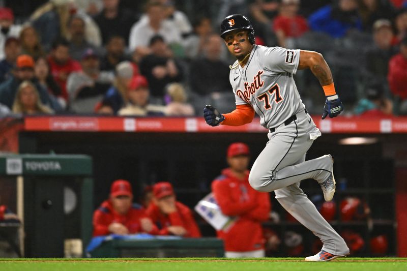 May 3, 2025; Anaheim, California, USA; Detroit Tigers third base Andy Ibáñez (77) runs to home plate to score one run against the Los Angeles Angels during the ninth inning at Angel Stadium. Mandatory Credit: Jonathan Hui-Imagn Images