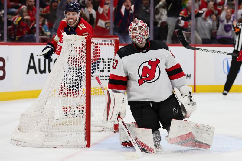 Jan 13, 2024; Sunrise, Florida, USA; New Jersey Devils goaltender Nico Daws (50) looks on after a goal by Florida Panthers center Sam Reinhart (not pictured) during the second period at Amerant Bank Arena. Mandatory Credit: Sam Navarro-USA TODAY Sports