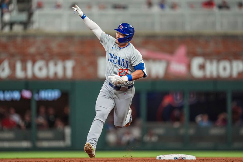 May 15, 2024; Cumberland, Georgia, USA; Chicago Cubs right fielder Seiya Suzuki (27) reacts after hitting a home run against the Atlanta Braves during the eighth inning at Truist Park. Mandatory Credit: Dale Zanine-USA TODAY Sports