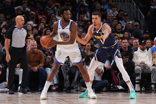 DENVER, CO - NOVEMBER 8: Andrew Wiggins #22 of the Golden State Warriors handles the ball during the game against the Denver Nuggets on November 8, 2023 at the Ball Arena in Denver, Colorado. NOTE TO USER: User expressly acknowledges and agrees that, by downloading and/or using this Photograph, user is consenting to the terms and conditions of the Getty Images License Agreement. Mandatory Copyright Notice: Copyright 2023 NBAE (Photo by Bart Young/NBAE via Getty Images)