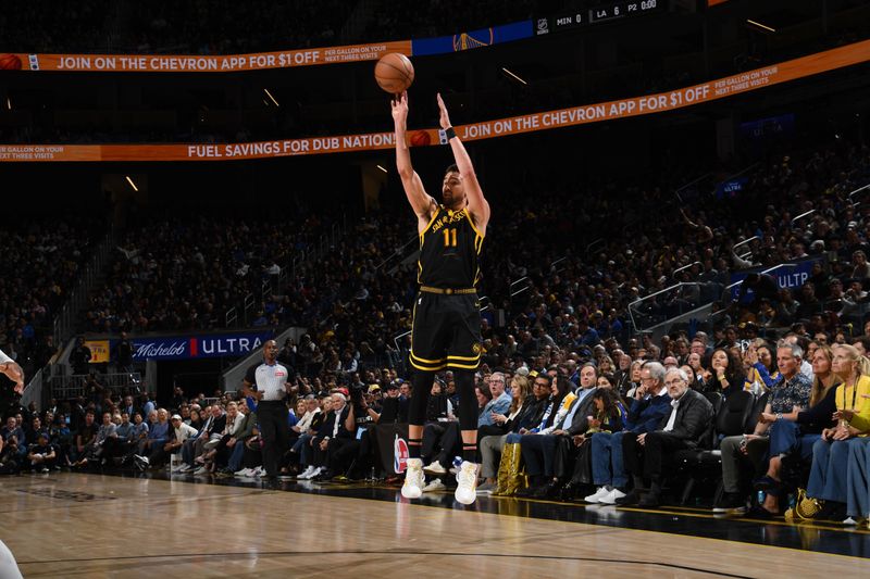 SAN FRANCISCO, CA - MARCH 20: Klay Thompson #11 of the Golden State Warriors shoots the ball during the game against the Memphis Grizzlies on March 20, 2024 at Chase Center in San Francisco, California. NOTE TO USER: User expressly acknowledges and agrees that, by downloading and or using this photograph, user is consenting to the terms and conditions of Getty Images License Agreement. Mandatory Copyright Notice: Copyright 2024 NBAE (Photo by Noah Graham/NBAE via Getty Images)