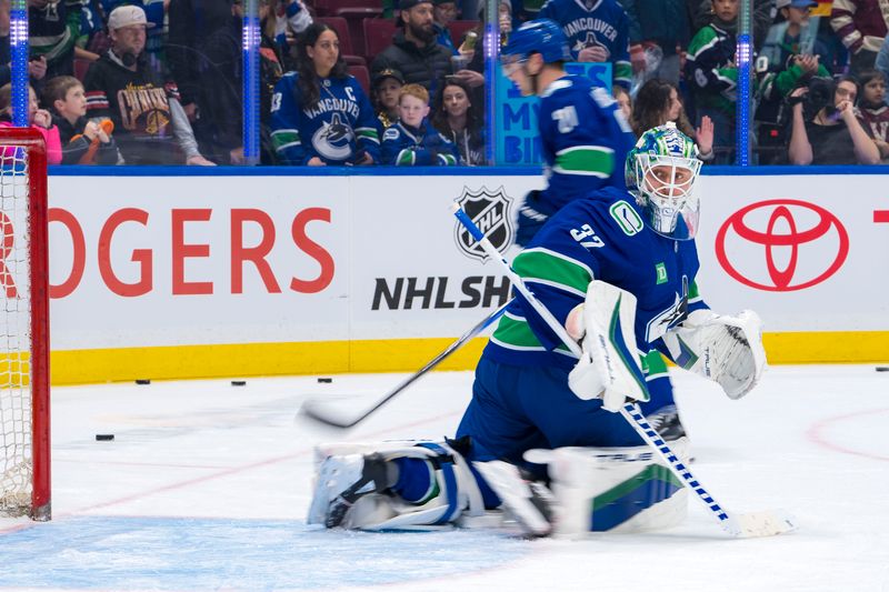 Nov 19, 2024; Vancouver, British Columbia, CAN; Vancouver Canucks goalie Kevin Lankinen (32) watches the rebound during warm up prior to a game against the New York Rangers at Rogers Arena. Mandatory Credit: Bob Frid-Imagn Images