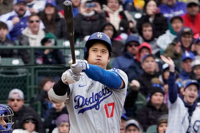 Apr 7, 2024; Chicago, Illinois, USA; Los Angeles Dodgers designated hitter Shohei Ohtani (17) strikes out against the Chicago Cubs during the first inning at Wrigley Field. Mandatory Credit: David Banks-USA TODAY Sports