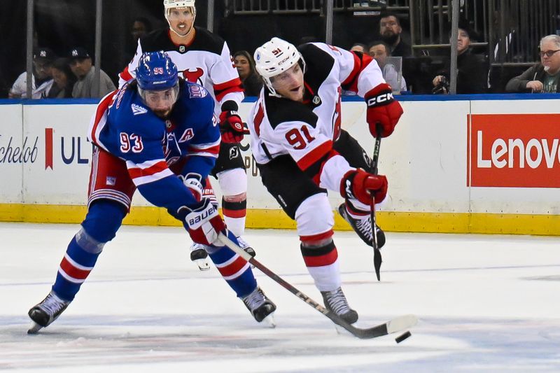 Oct 2, 2025; New York, New York, USA;  New Jersey Devils center Dawson Mercer (91) shoots and scores on an empty net defended by New York Rangers center Mika Zibanejad (93) during the third period at Madison Square Garden. Mandatory Credit: Dennis Schneidler-Imagn Images