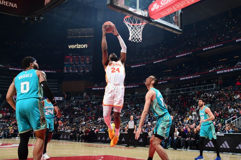ATLANTA, GA - MARCH 23: Bruno Fernando #24 of the Atlanta Hawks dunks the ball during the game against the Charlotte Hornets on March 23, 2024 at State Farm Arena in Atlanta, Georgia.  NOTE TO USER: User expressly acknowledges and agrees that, by downloading and/or using this Photograph, user is consenting to the terms and conditions of the Getty Images License Agreement. Mandatory Copyright Notice: Copyright 2024 NBAE (Photo by Scott Cunningham/NBAE via Getty Images)