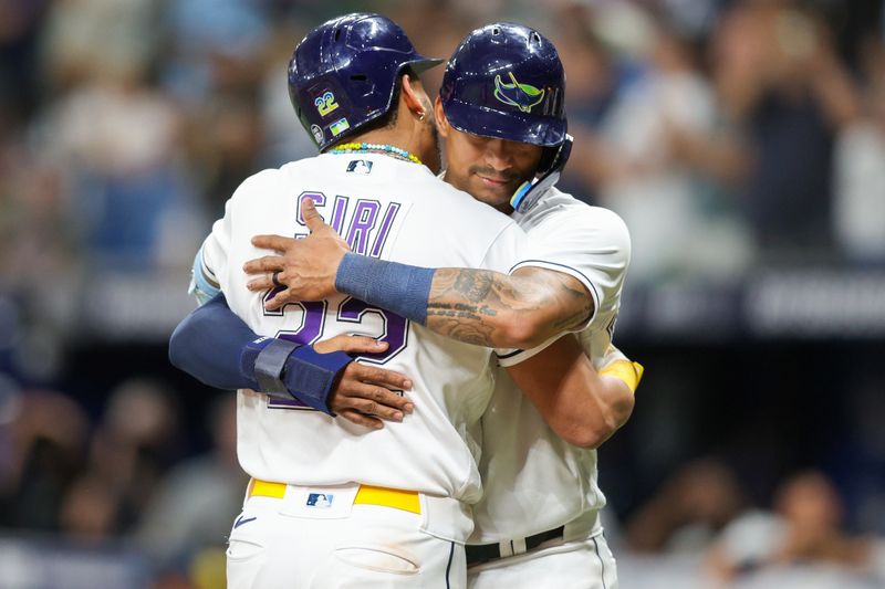 May 26, 2023; St. Petersburg, Florida, USA;  Tampa Bay Rays center fielder Jose Siri is congratulated by catcher Christian Bethancourt (14) after hitting a two run home run against the Los Angeles Dodgers in the eighth inning at Tropicana Field. Mandatory Credit: Nathan Ray Seebeck-USA TODAY Sports