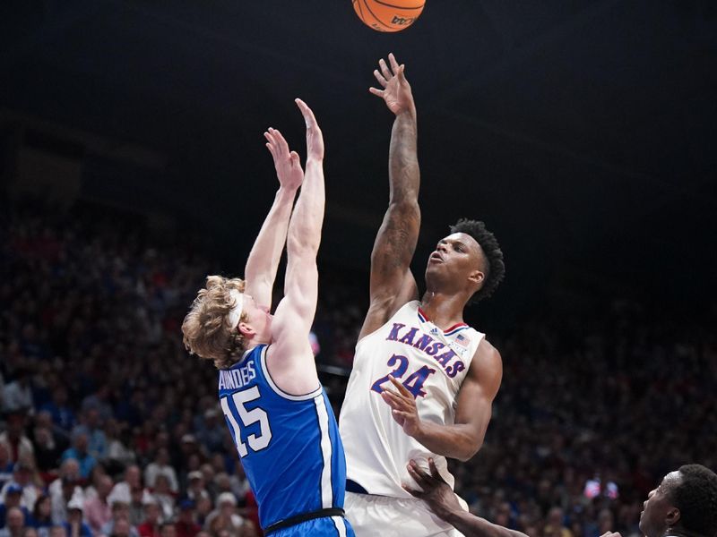 Feb 27, 2024; Lawrence, Kansas, USA; Kansas Jayhawks forward K.J. Adams Jr. (24) shoots over Brigham Young Cougars guard Richie Saunders (15) during the second half at Allen Fieldhouse. Mandatory Credit: Denny Medley-USA TODAY Sports