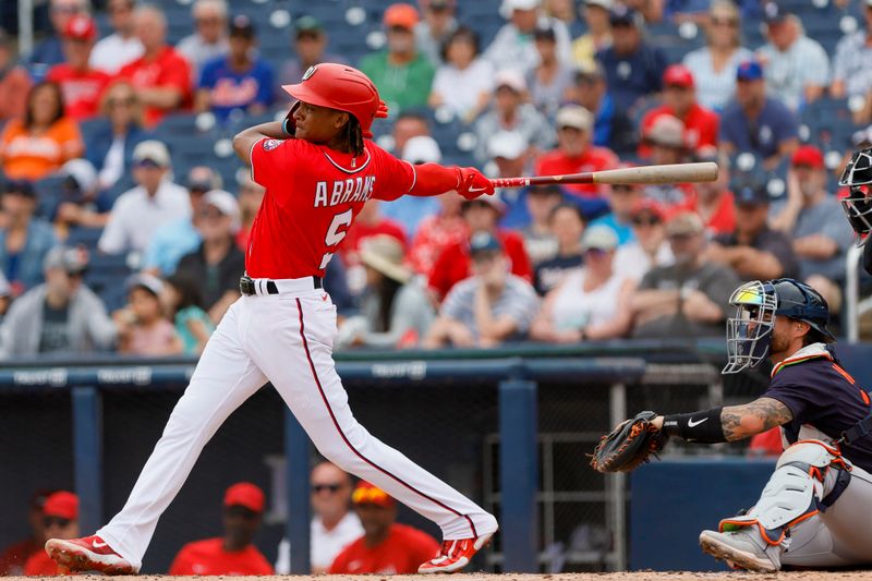 Mar 19, 2023; West Palm Beach, Florida, USA; Washington Nationals shortstop CJ Abrams (5) hits a double during the second inning against the Detroit Tigers at The Ballpark of the Palm Beaches. Mandatory Credit: Sam Navarro-USA TODAY Sports