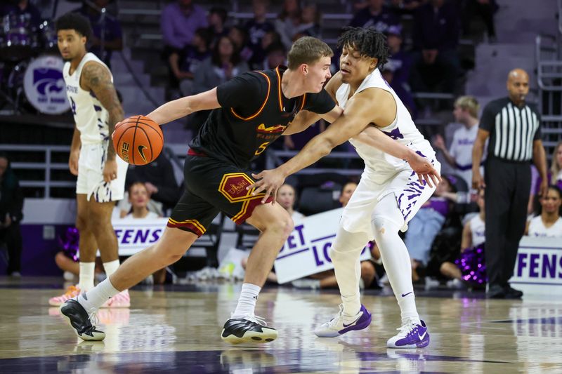 Dec 28, 2025; Manhattan, Kansas, USA; Louisiana-Monroe Warhawks forward Renars Sondors (5) is guarded by Kansas State Wildcats forward Elias Rapieque (0) during the second half at Bramlage Coliseum. Mandatory Credit: Scott Sewell-Imagn Images