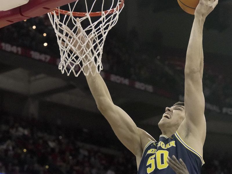 Dec 3, 2024; Madison, Wisconsin, USA; Michigan center Vladislav Goldin (50) scores on =tph22j= during the first half of their game Tuesday, December 3, 2024 at the Kohl Center in Madison, Wisconsin.  Mandatory Credit: Mark Hoffman/USA TODAY Network via Imagn Images 