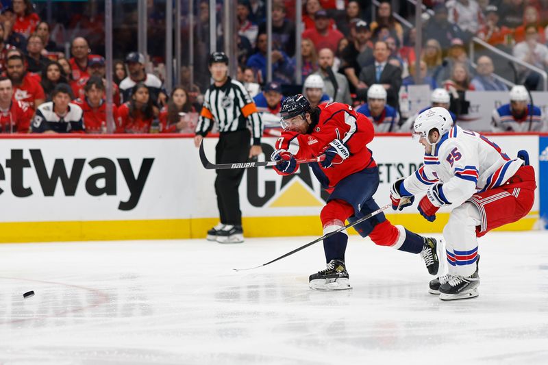 Apr 28, 2024; Washington, District of Columbia, USA; Washington Capitals right wing T.J. Oshie (77) shoots the puck as New York Rangers defenseman Ryan Lindgren (55) defends in the third period in game four of the first round of the 2024 Stanley Cup Playoffs at Capital One Arena. Mandatory Credit: Geoff Burke-USA TODAY Sports