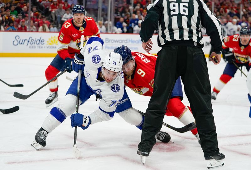 Dec 27, 2025; Sunrise, Florida, USA; Tampa Bay Lightning center Anthony Cirelli (71) battles Florida Panthers center Sam Bennett (9) for a face-off during the third period at Amerant Bank Arena. Mandatory Credit: Jeff Romance-Imagn Images