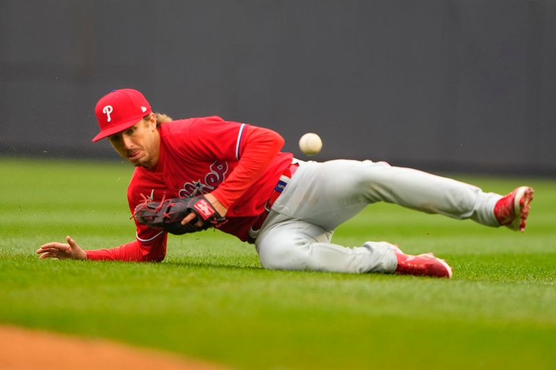 Apr 5, 2023; Bronx, New York, USA; Philadelphia Phillies second baseman Bryson Stott (5) attempts to field a ground ball hit by New York Yankees right fielder Franchy Cordero (33) (not pictured) during the fifth inning at Yankee Stadium. Mandatory Credit: Gregory Fisher-USA TODAY Sports