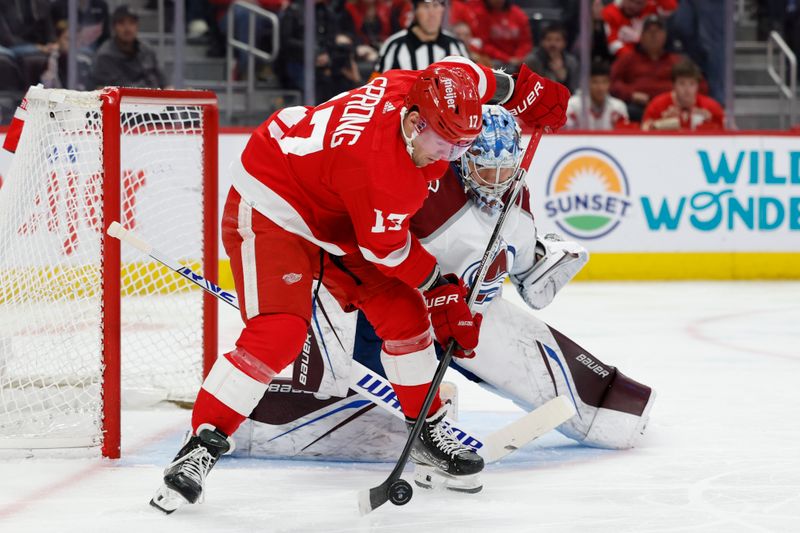 Feb 22, 2024; Detroit, Michigan, USA;  Detroit Red Wings right wing Daniel Sprong (17) skates with the puck in front of Colorado Avalanche goaltender Justus Annunen (60) in the second period at Little Caesars Arena. Mandatory Credit: Rick Osentoski-USA TODAY Sports