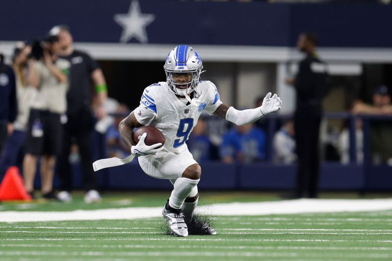 Detroit Lions wide receiver Jameson Williams (9) carries the ball after a reception during an NFL football game against the Dallas Cowboys, Saturday, Dec. 30, 2023, in Arlington, Texas. (AP Photo/Matt Patterson)