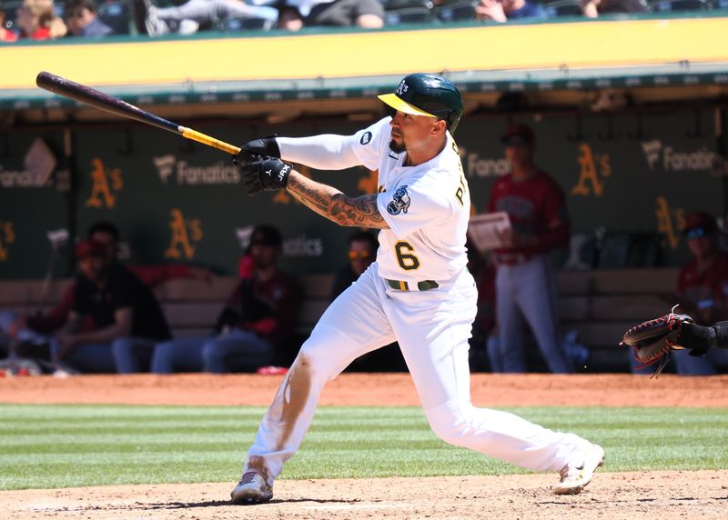 May 17, 2023; Oakland, California, USA; Oakland Athletics third baseman Jace Peterson (6) hits a single against the Arizona Diamondbacks during the eighth inning at Oakland-Alameda County Coliseum. Mandatory Credit: Kelley L Cox-USA TODAY Sports