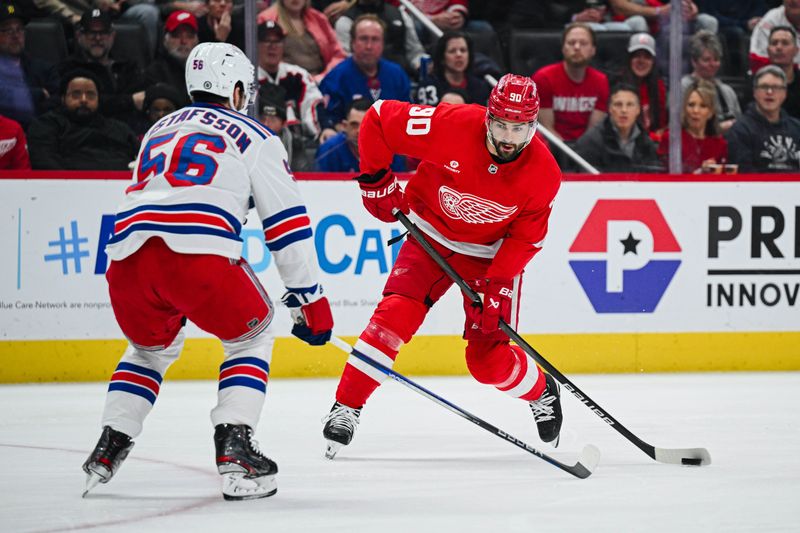 Apr 5, 2024; Detroit, Michigan, USA; Detroit Red Wings center Joe Veleno (90) shoots as New York Rangers defenseman Erik Gustafsson (56) defends during the game at Little Caesars Arena. Mandatory Credit: Tim Fuller-USA TODAY Sports