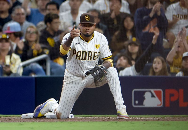 Oct 8, 2024; San Diego, California, USA; San Diego Padres first baseman Luis Arraez (4) reacts after an out in the sixth inning against the Los Angeles Dodgers during game three of the NLDS for the 2024 MLB Playoffs at Petco Park. Mandatory Credit: David Frerker-Imagn Images