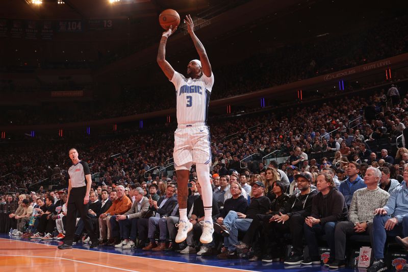 NEW YORK, NY - DECEMBER 3: Kentavious Caldwell-Pope #3 of the Orlando Magic shoots a three point basket during the game  against the New York Knicks during the Emirates NBA Cup on December 3, 2024 at Madison Square Garden in New York City, New York.  NOTE TO USER: User expressly acknowledges and agrees that, by downloading and or using this photograph, User is consenting to the terms and conditions of the Getty Images License Agreement. Mandatory Copyright Notice: Copyright 2024 NBAE  (Photo by Nathaniel S. Butler/NBAE via Getty Images)