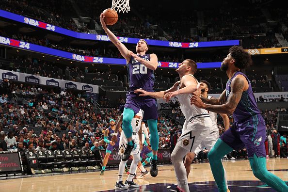 CHARLOTTE, NC - DECEMBER 23: Gordon Hayward #20 of the Charlotte Hornets shoots the ball during the game against the Denver Nuggets  on December 23, 2023 at Spectrum Center in Charlotte, North Carolina. NOTE TO USER: User expressly acknowledges and agrees that, by downloading and or using this photograph, User is consenting to the terms and conditions of the Getty Images License Agreement. Mandatory Copyright Notice: Copyright 2023 NBAE (Photo by Kent Smith/NBAE via Getty Images)