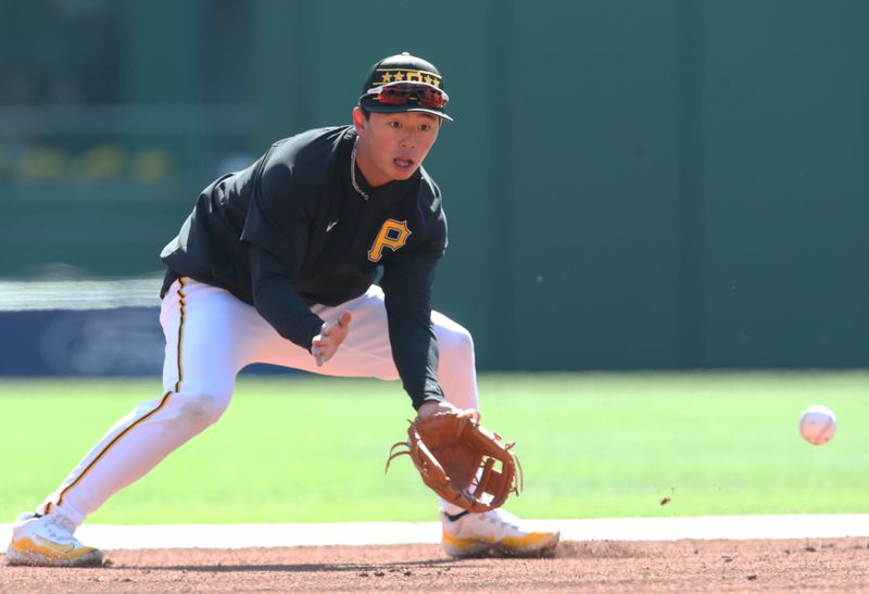 Apr 9, 2025; Pittsburgh, Pennsylvania, USA;  Pittsburgh Pirates shortstop Tsung-Che Cheng  (71) warms up before making his major league debut against the St. Louis Cardinals at PNC Park. Mandatory Credit: Charles LeClaire-Imagn Images