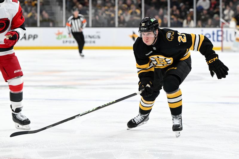 Nov 17, 2025; Boston, Massachusetts, USA; Boston Bruins center Alex Steeves (21) skates against the Carolina Hurricanes during the first period at the TD Garden. Mandatory Credit: Brian Fluharty-Imagn Images
