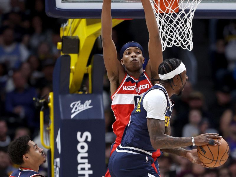 DENVER, COLORADO - FEBRUARY 22: Kentavious Caldwell-Pope #5 of the Denver Nuggets goes to the basket against Bilal Coulibaly #0 of the Washington Wizards in the first quarter at Ball Arena on February 22, 2024 in Denver, Colorado. NOTE TO USER: User expressly acknowledges and agrees that, by downloading and or using this photograph, User is consenting to the terms and conditions of the Getty Images License Agreement. (Photo by Matthew Stockman/Getty Images)