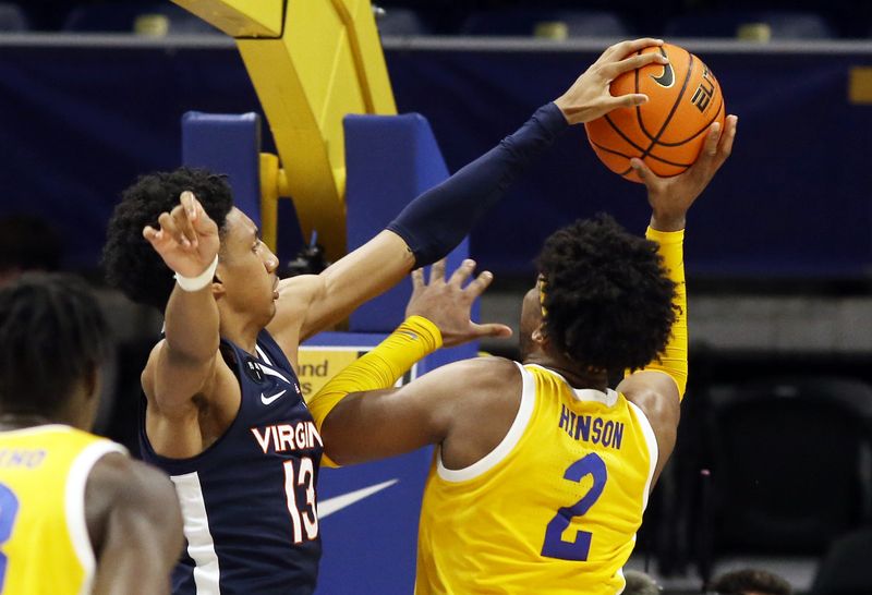 Jan 3, 2023; Pittsburgh, Pennsylvania, USA; Virginia Cavaliers guard Ryan Dunn (13) blocks the shot attempt of Pittsburgh Panthers forward Blake Hinson (2) /d2h at the Petersen Events Center. Dunn was called for a foul on the play. Pittsburgh won 68-65. Mandatory Credit: Charles LeClaire-USA TODAY Sports