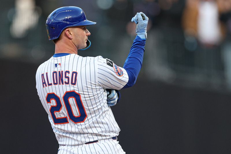 Apr 8, 2025; New York City, New York, USA; New York Mets first baseman Pete Alonso (20) reacts after hitting a three RBI double during the sixth inning against the Miami Marlins at Citi Field. Mandatory Credit: Vincent Carchietta-Imagn Images